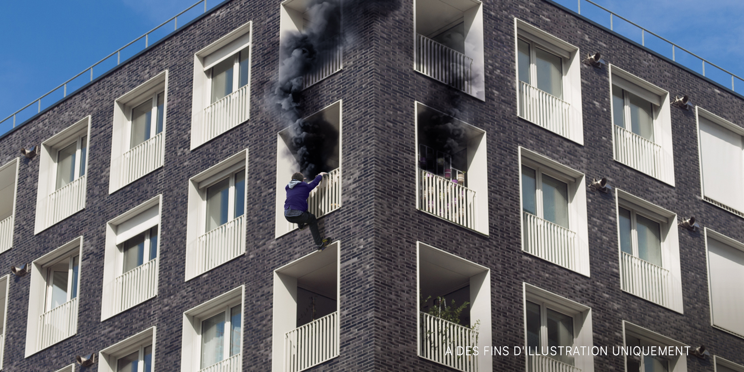Immeuble d'habitation en feu | Source : Getty Images