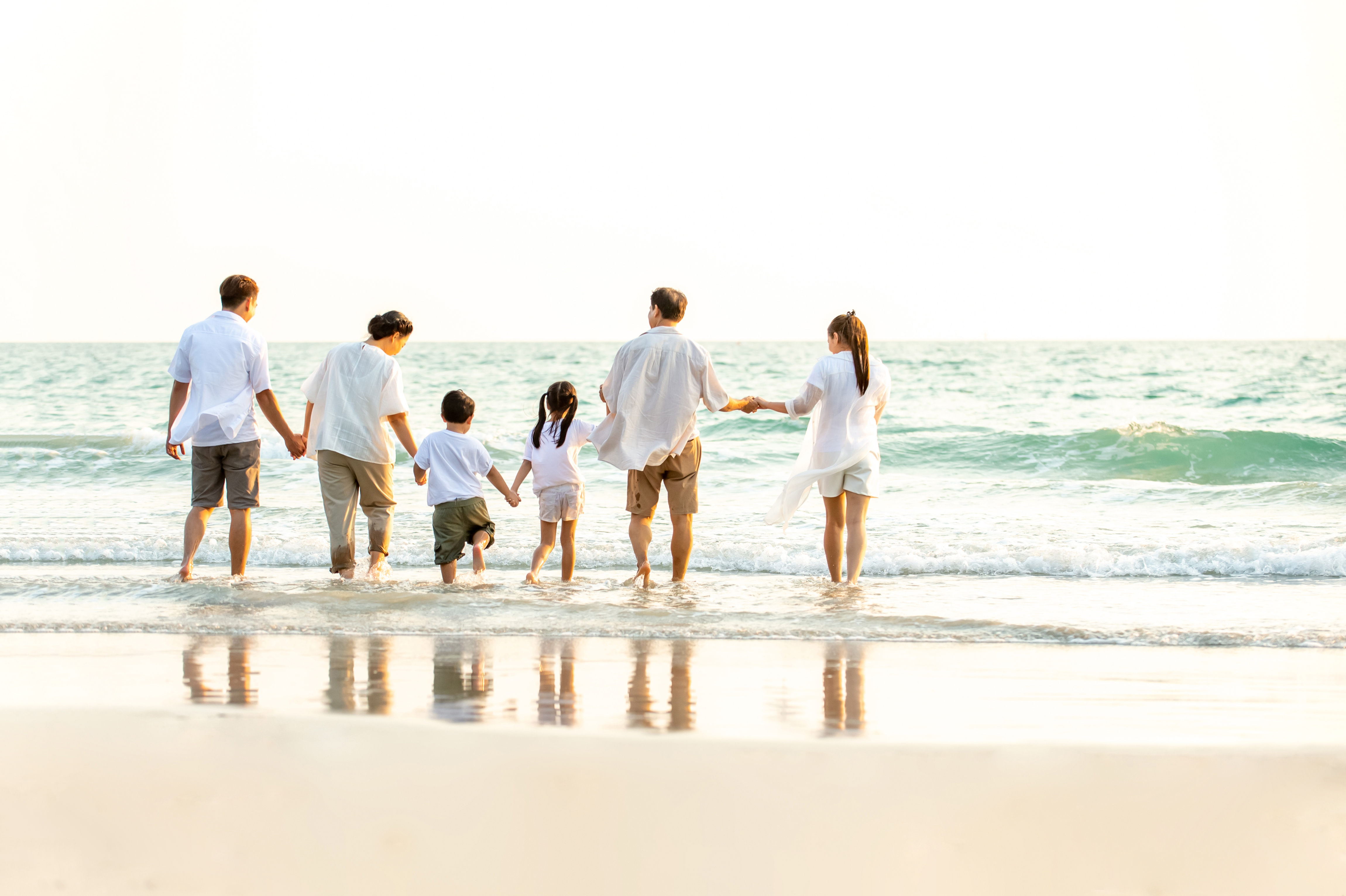 A family at the beach | Source: Shutterstock