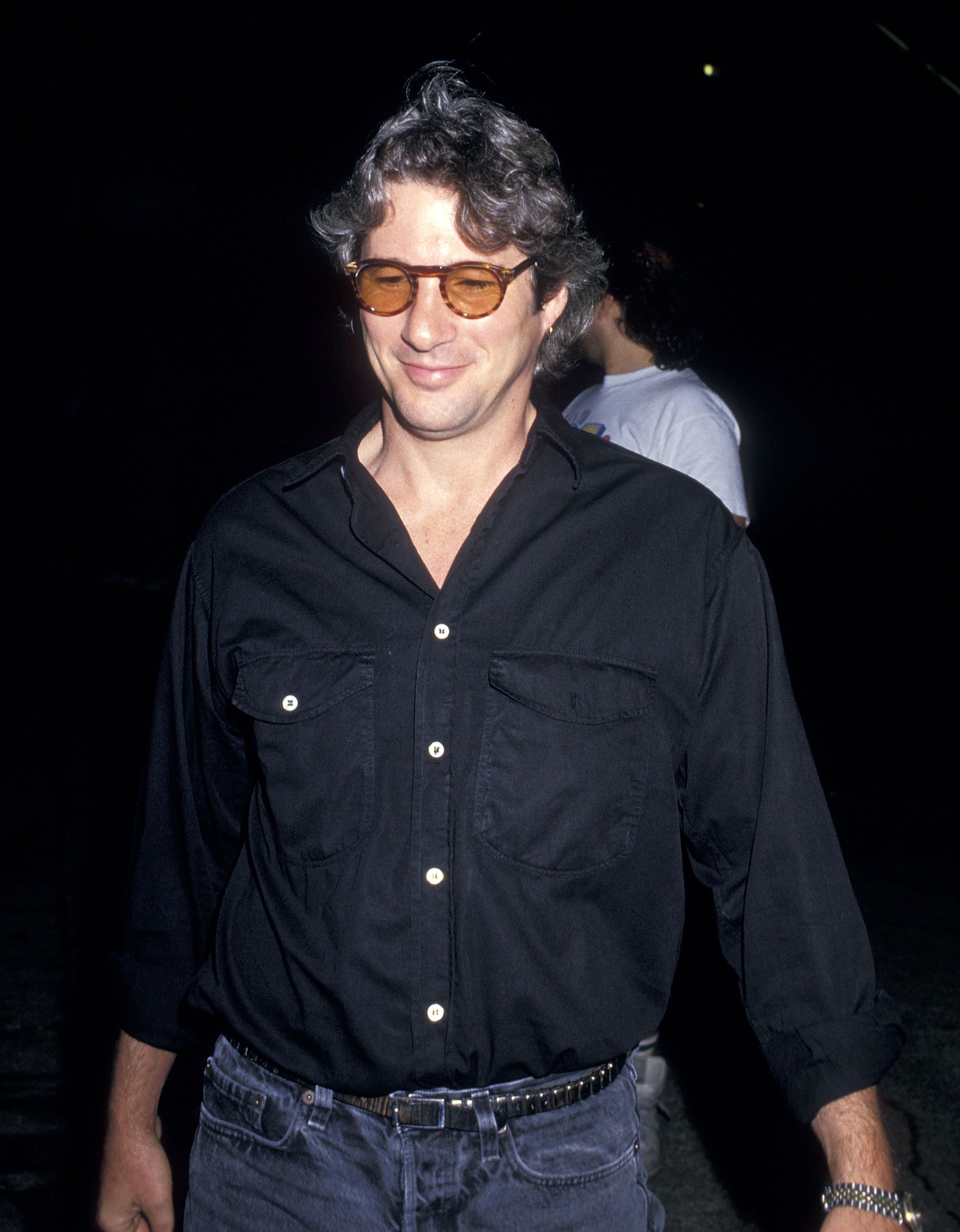Richard Gere lors d'un concert de Madonna pour le Who's That Girl World Tour le 13 juillet 1987. | Photo : Getty Images