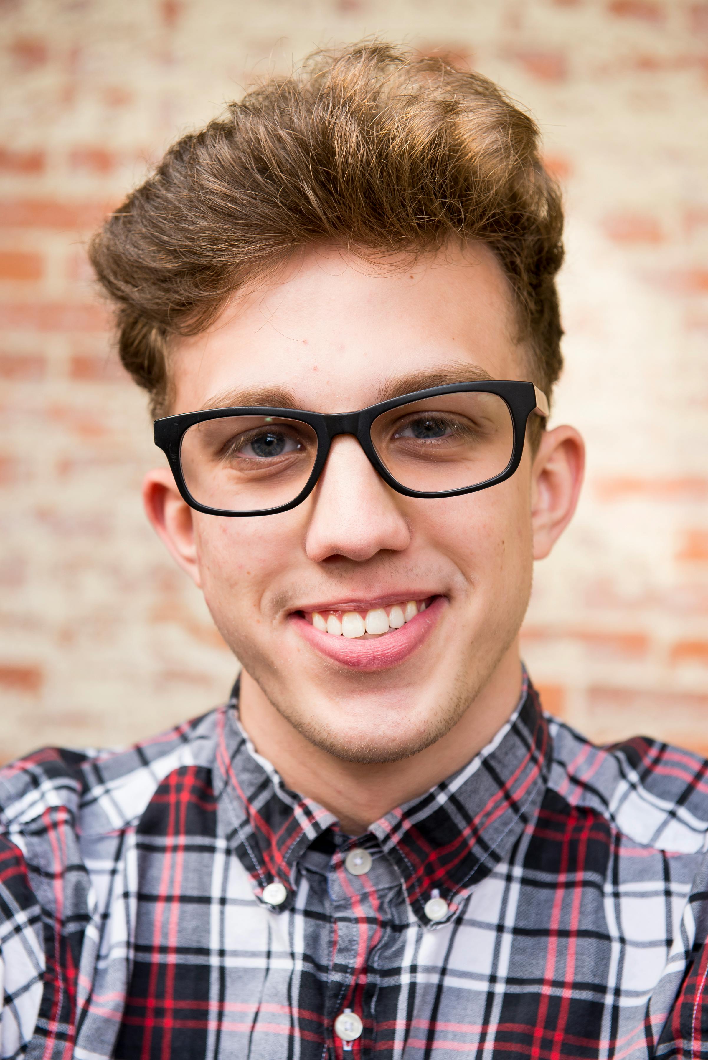 Un jeune homme souriant | Source : Pexels