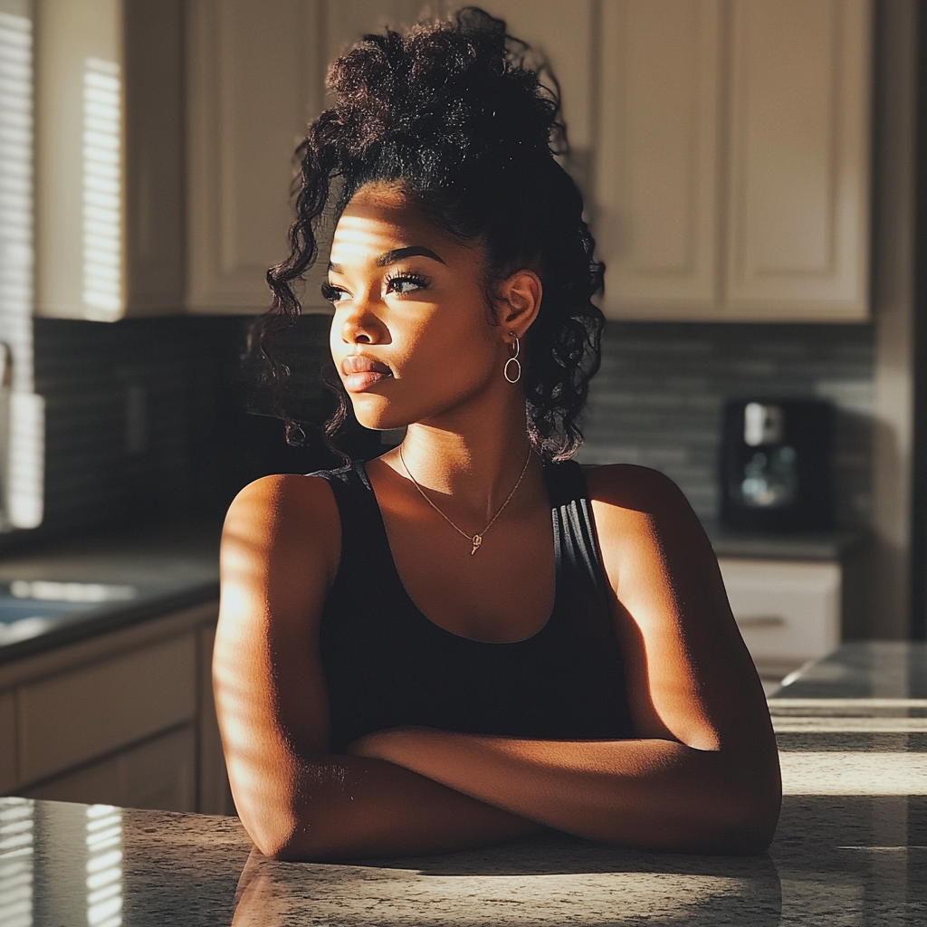 Une femme assise à un comptoir de cuisine | Source : Midjourney