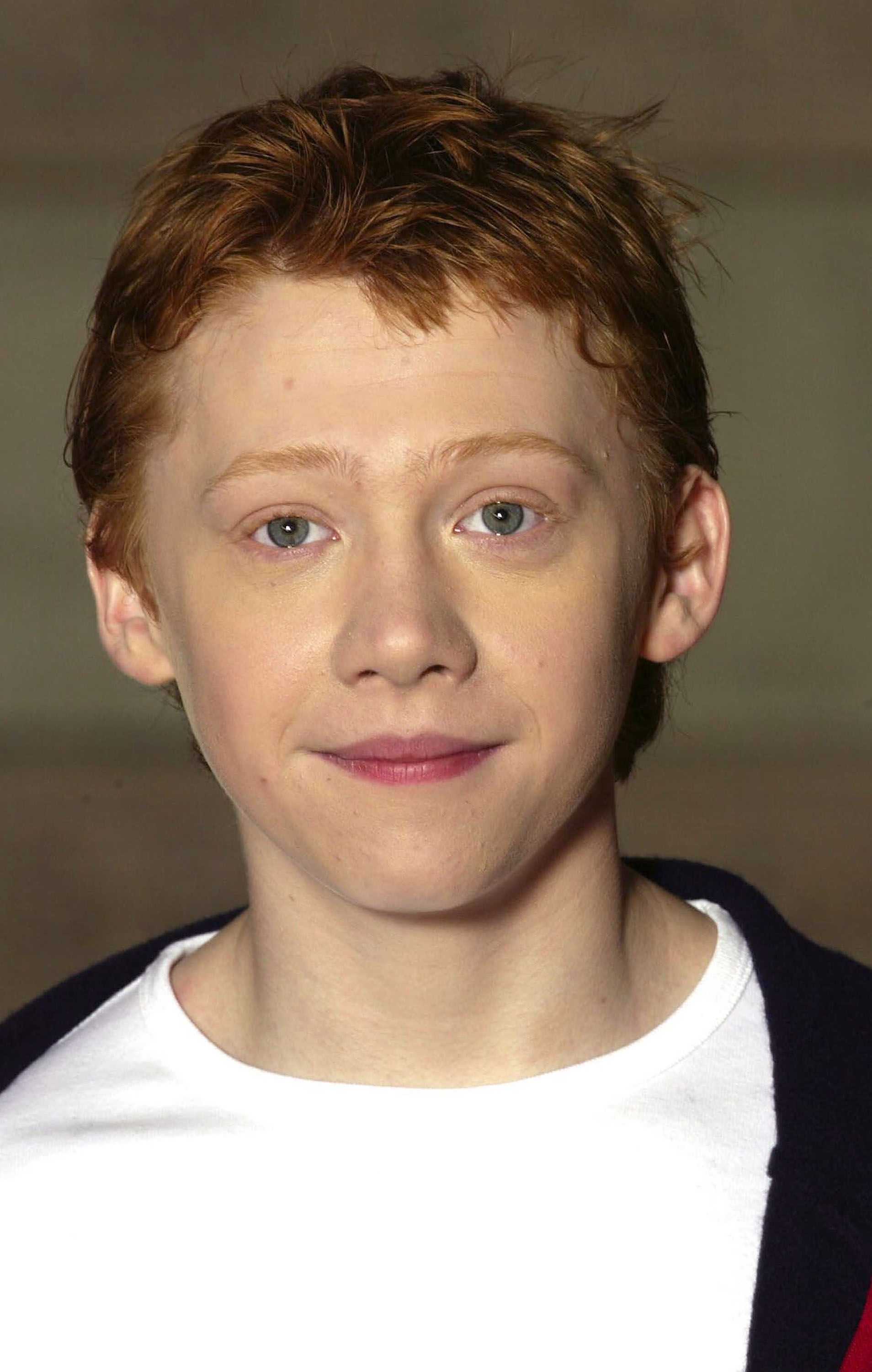 Rupert Grint lors d'un photocall pour "Harry Potter et la Chambre des Secrets", le 25 octobre 2002, à Londres, Royaume-Uni | Source : Getty Images