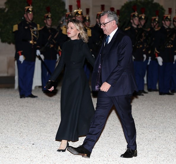 Richard Ferrand et sa compagne Sandrine Doucen arrivent au Palais de l'Élysée à Paris, France, le 15 octobre 2018. | Photo : Getty Images