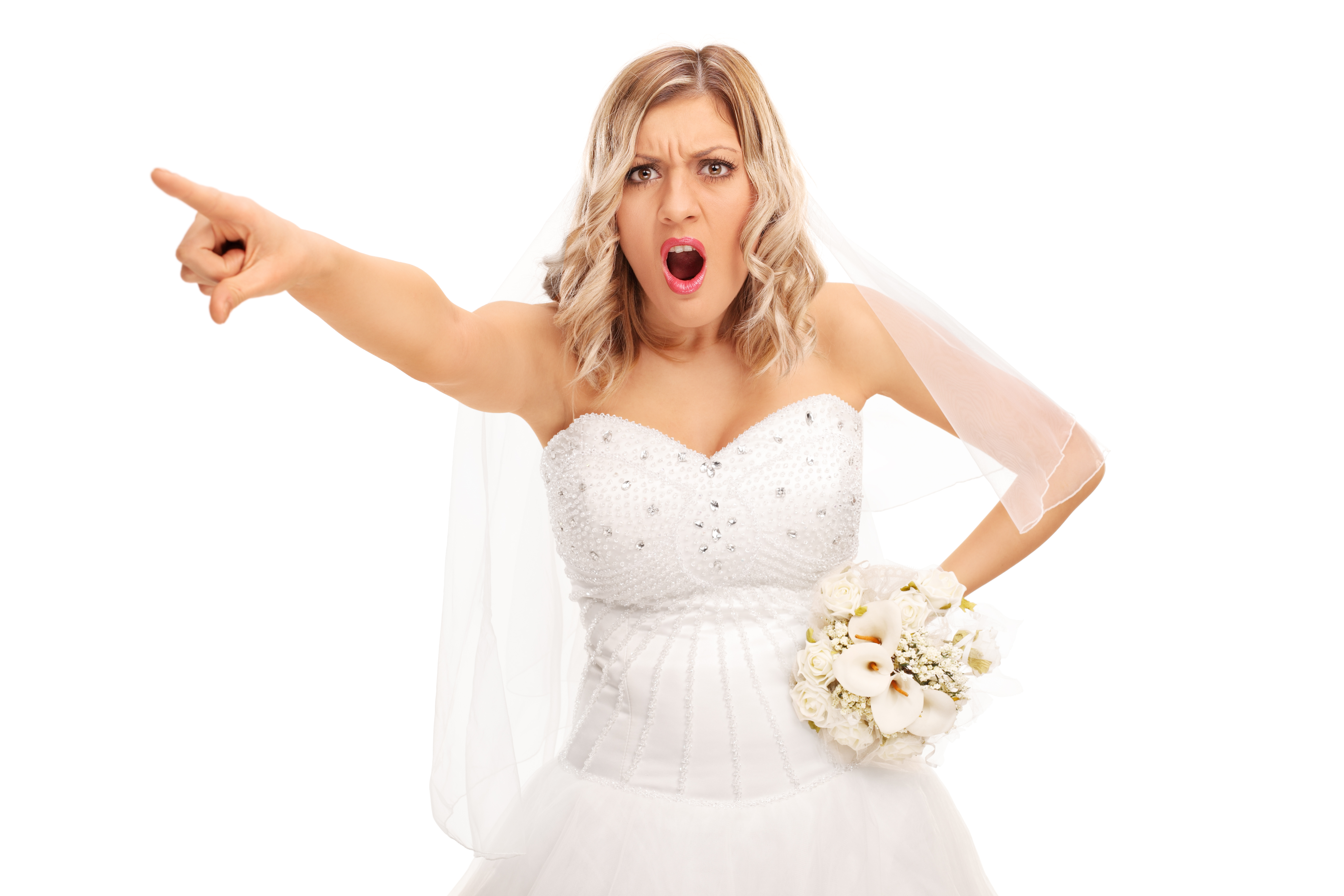 Une mariée en colère pointant du doigt l'extérieur du cadre | Source : Shutterstock