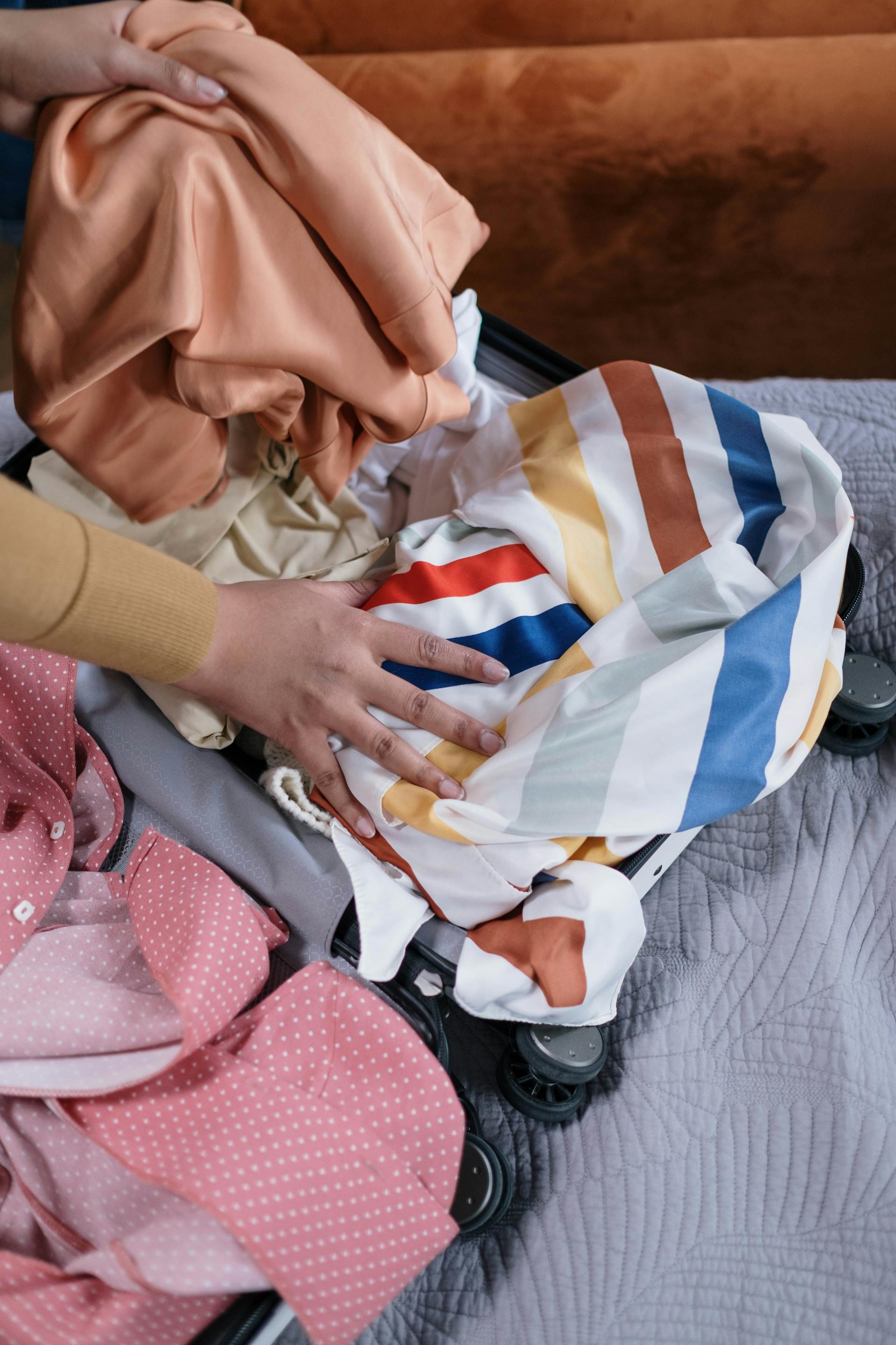 A person packing their suitcase | Source: Pexels