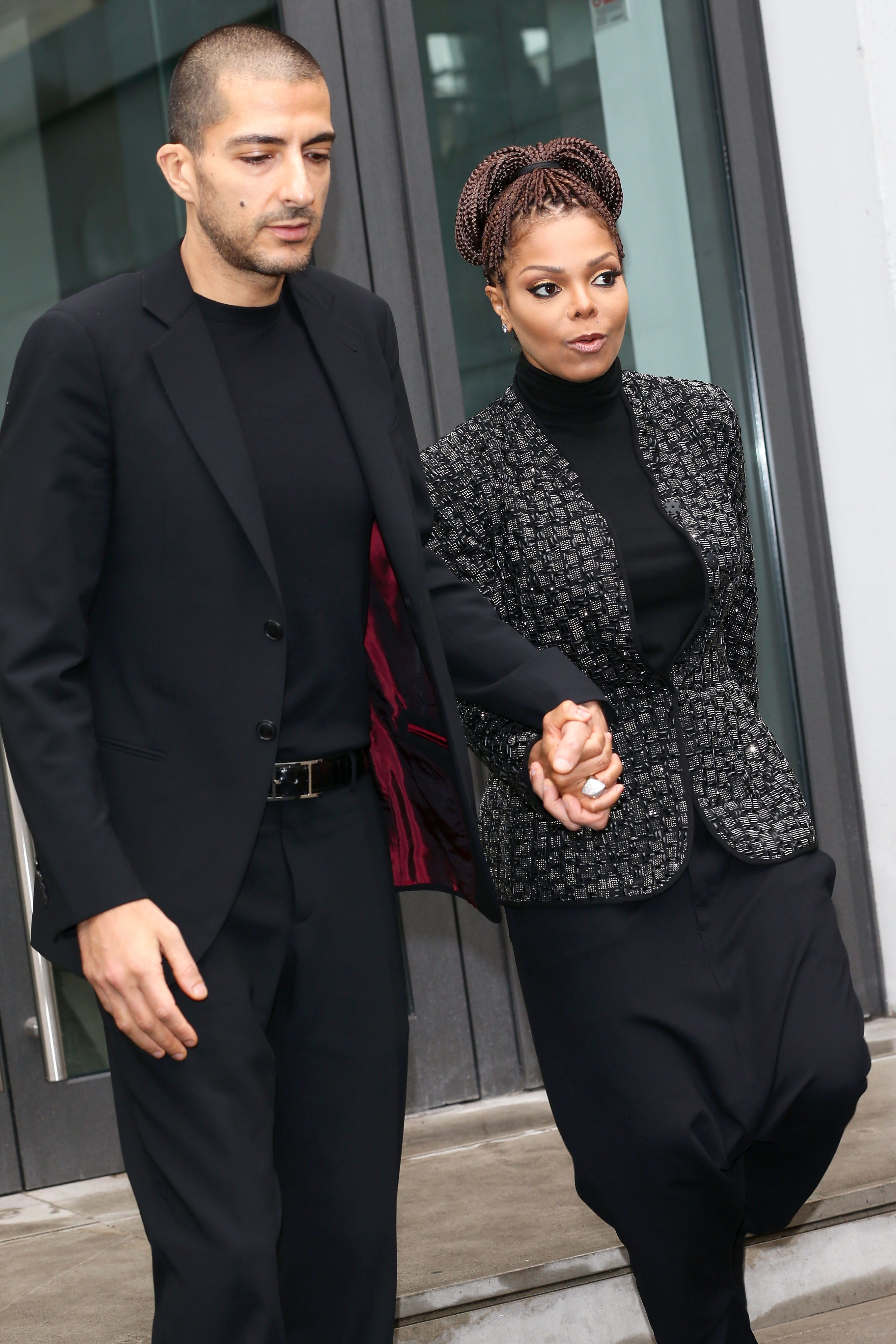 Wissam al Mana et Janet Jackson au défilé de mode Giorgio Armani dans le cadre de la Semaine de la mode féminine de Milan automne/hiver 2013/14, le 25 février 2014, à Milan, Italie | Source : Getty Images