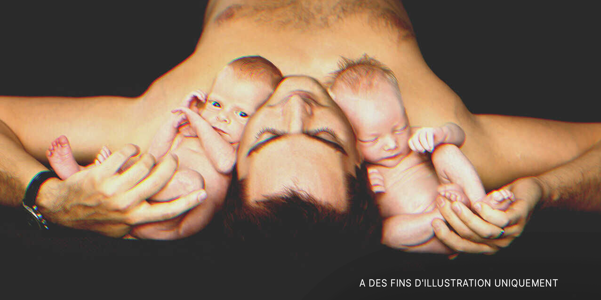 Un homme avec deux bébés. | Source : Shutterstock